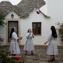Nuns Playing with a Ball in a Charming Courtyard