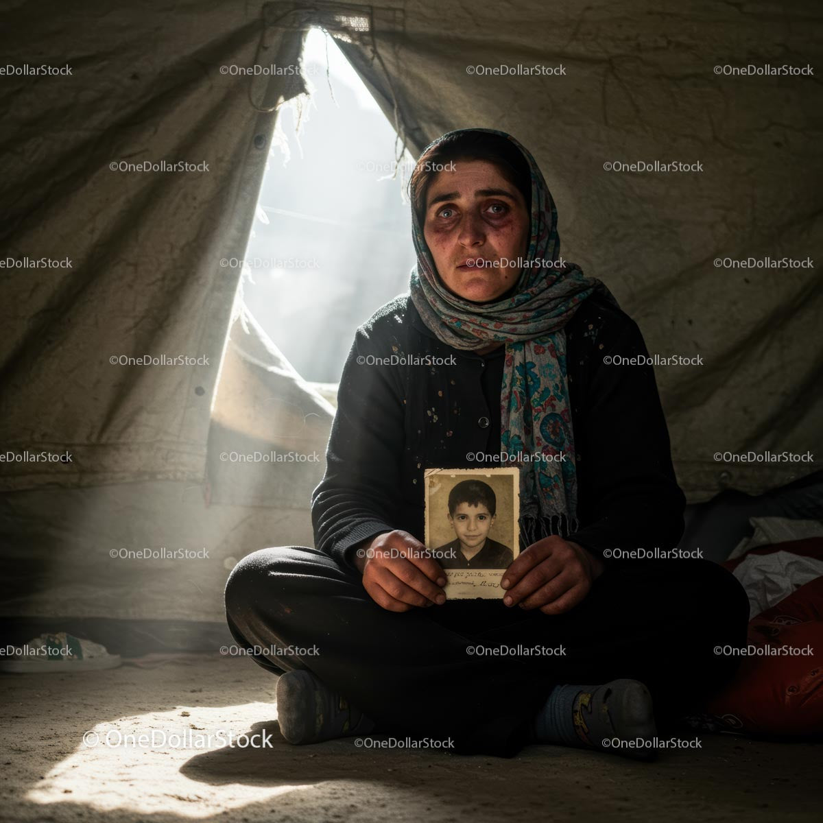 Woman Holding Photograph Inside Refugee Tent