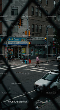 Urban Street Corner with Pedestrian and Storefronts