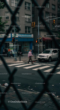 City Street Scene with Pedestrian and Traffic Light