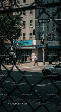Urban Street View with Blurred Motion and Fence Foreground