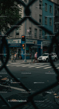 Urban Street Corner with Blue Building and Traffic Light