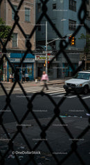 Urban Street View Through Chain Link Fence