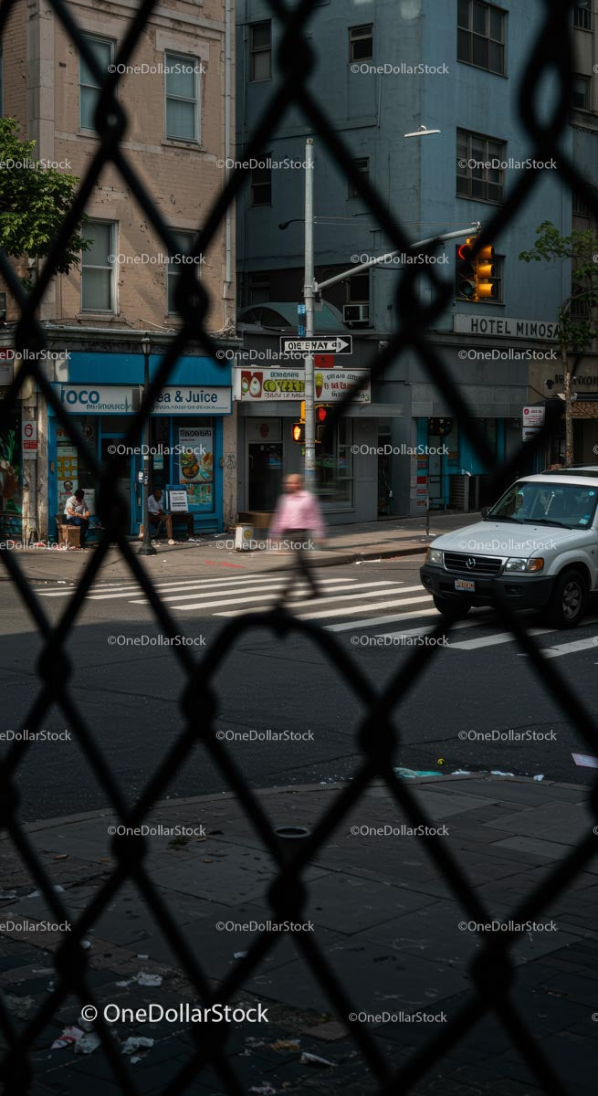 Urban Street View Through Chain Link Fence