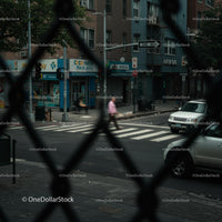 Urban Street View Through Chain-Link Fence