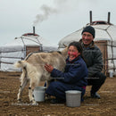 Mongolian Family with Goat in Traditional Nomadic Setting