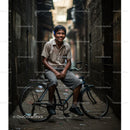 Smiling Boy Enjoying a Ride in a Vibrant Urban Alley