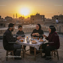 Family Enjoying Rooftop Dinner at Sunset