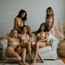 Confident Women in Lingerie Relaxing in Modern Interior