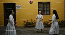 Nuns Enjoying Leisure Time in a Sunny Courtyard