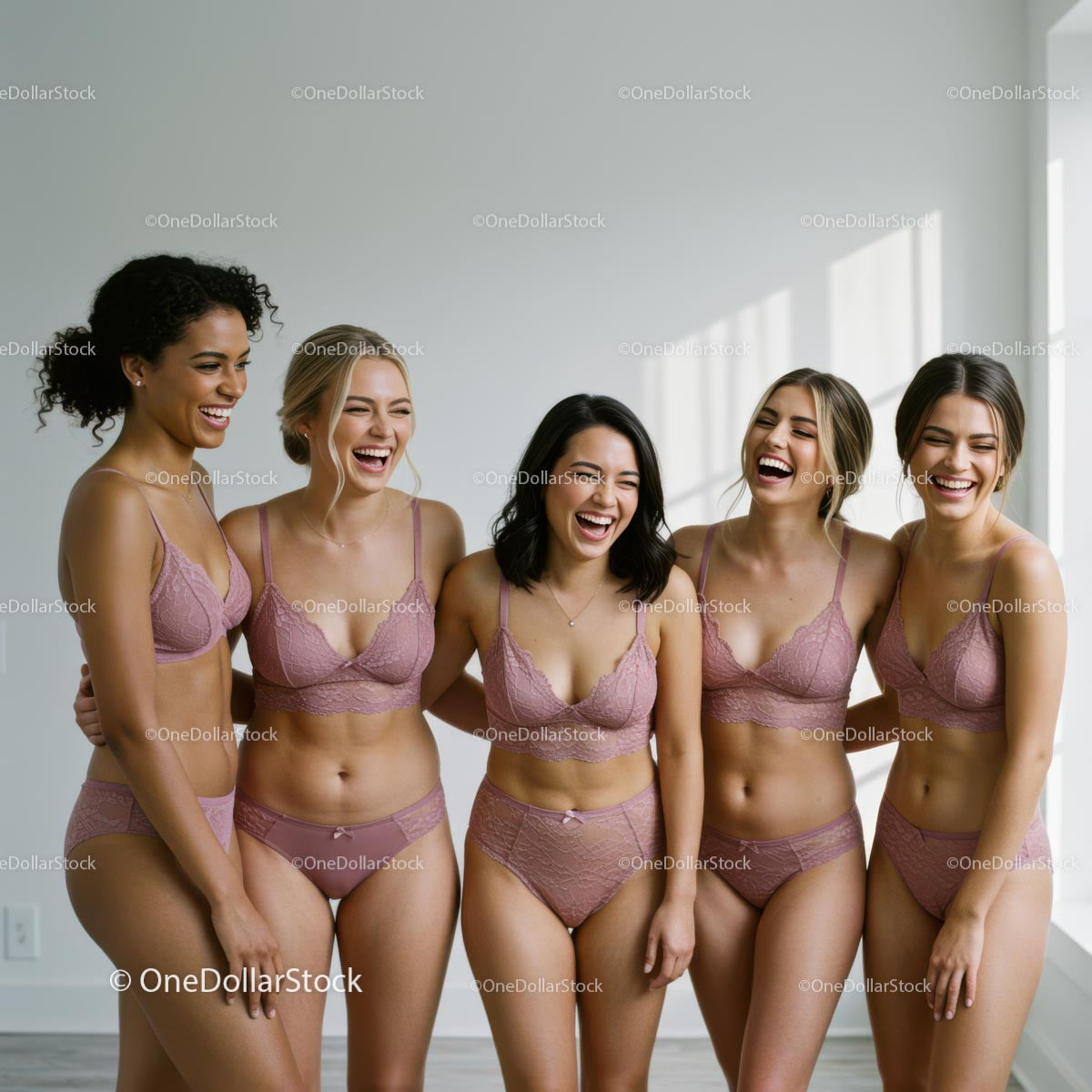 Group of Laughing Women in Pink Lingerie Enjoying Together