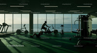 Silhouette Workout in Oceanfront Gym with Expansive Views