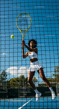 Athletic Woman Playing Tennis on Sunny Day