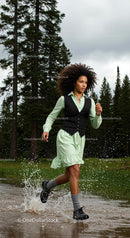Woman Running Through Forest Trail in Green Dress