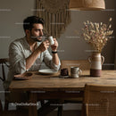 Young Man Enjoying Coffee in Cozy Rustic Home Setting