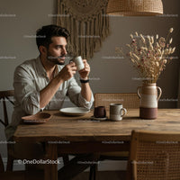 Young Man Enjoying Coffee in Cozy Rustic Home Setting