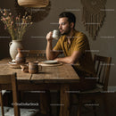 Man Enjoying Morning Coffee in Cozy Rustic Interior