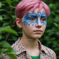 Pink-Haired Youth with Artistic Blue Face Paint in Nature