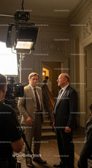 Actors in Dialogue on a Movie Set with Film Crew