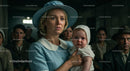 Worried Mother Holding Her Child in Vintage Blue Attire