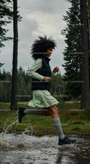 Woman Running Through Forest Splashing in Water