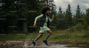 Woman in Motion Through Forested Path and Splashing Water