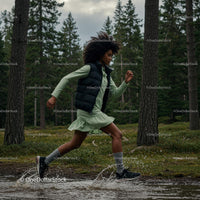 Energetic Woman Running Through Forest Trail