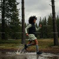 Woman Running Through a Forest Trail with Energetic Splash