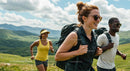 Group of Friends Hiking Through Lush Green Mountains