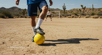 Soccer Game on a Sunlit Desert Field