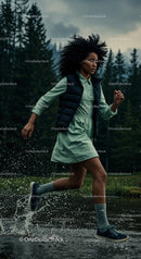 Young Woman Running Through Forest Creek
