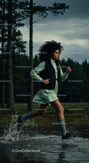 Energetic Woman Running Through Forest Trail