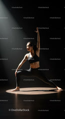 Woman Practicing Yoga Pose in Dramatic Spotlight