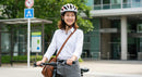 Smiling Woman Cycling in Urban Cityscape