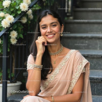 Smiling Woman in Elegant Saree with Floral Background