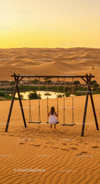 Child on Swing Overlooking Tranquil Desert Oasis