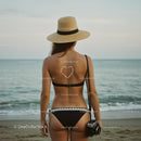 Woman in Bikini Relaxing on a Tranquil Beach