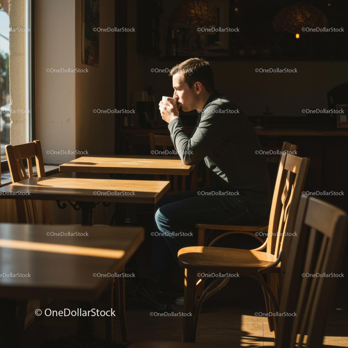Man Enjoying Coffee in Sunlit Cafe