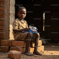 Young Boy Enjoying Hands-On Creativity with DIY Toy