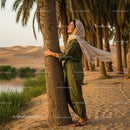 Woman Enjoying Oasis Serenity Among Palm Trees