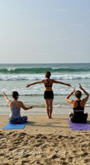 Group Yoga Session on a Tranquil Beachfront