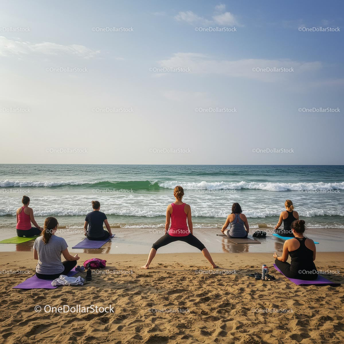 Group Yoga Session on a Sunny Beach by the Ocean