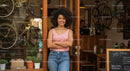 Friendly Small Business Owner in Bicycle Shop Entrance