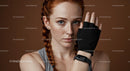 Focused Redhead Woman with Fitness Glove and Smartwatch
