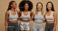 Diverse Women in Trendy Activewear Smiling Together