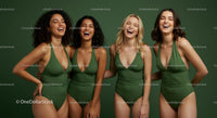 Diverse Group of Women Laughing in Green Swimsuits
