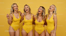 Joyful Group of Women in Yellow Swimsuits Laughing Together