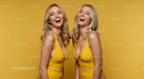 Smiling Blonde Women in Yellow on Vibrant Background