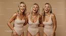 Joyful Group of Women in Stylish Beige Swimwear