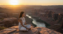 Woman Meditating at Sunset Overlooking Majestic Canyon
